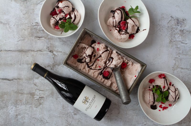 Creamy cinsault ice cream with a rich chocolate sauce serve with fresh berries